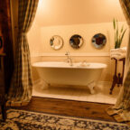 Luxury bathtub with book tray in the Cousin Sarah room