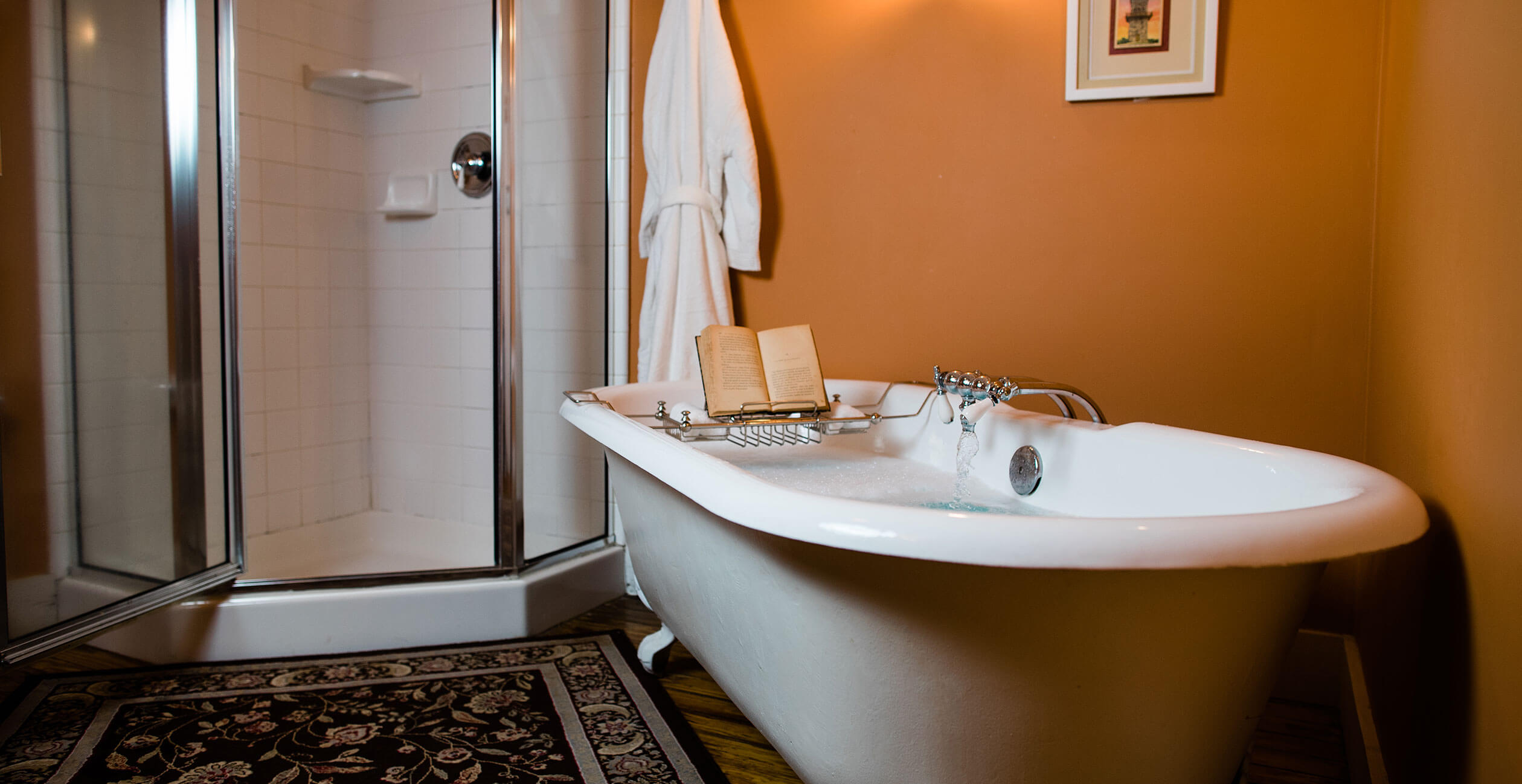 Book tray on bathtub next to shower