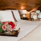 Tray of flowers on bed in the Cherry Room