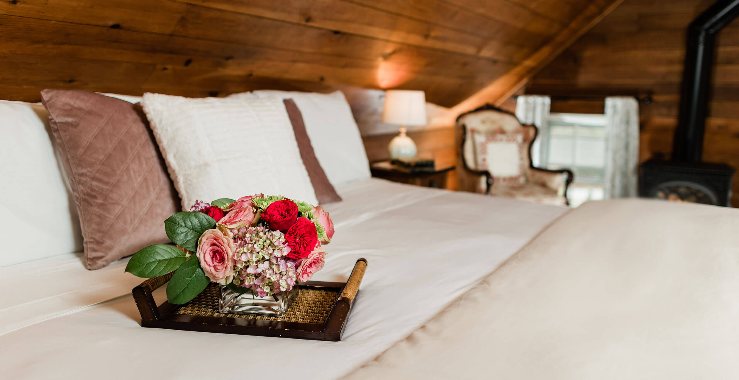 Tray of flowers on bed in the Cherry Room