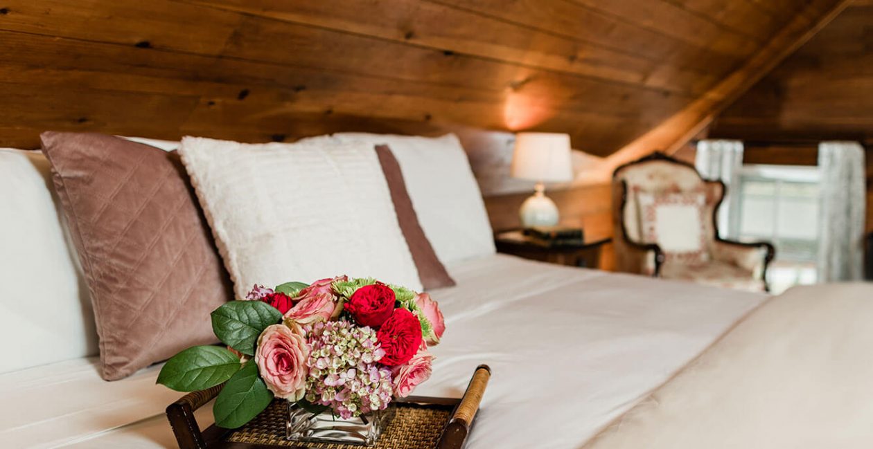 Tray of flowers on bed in the Cherry Room