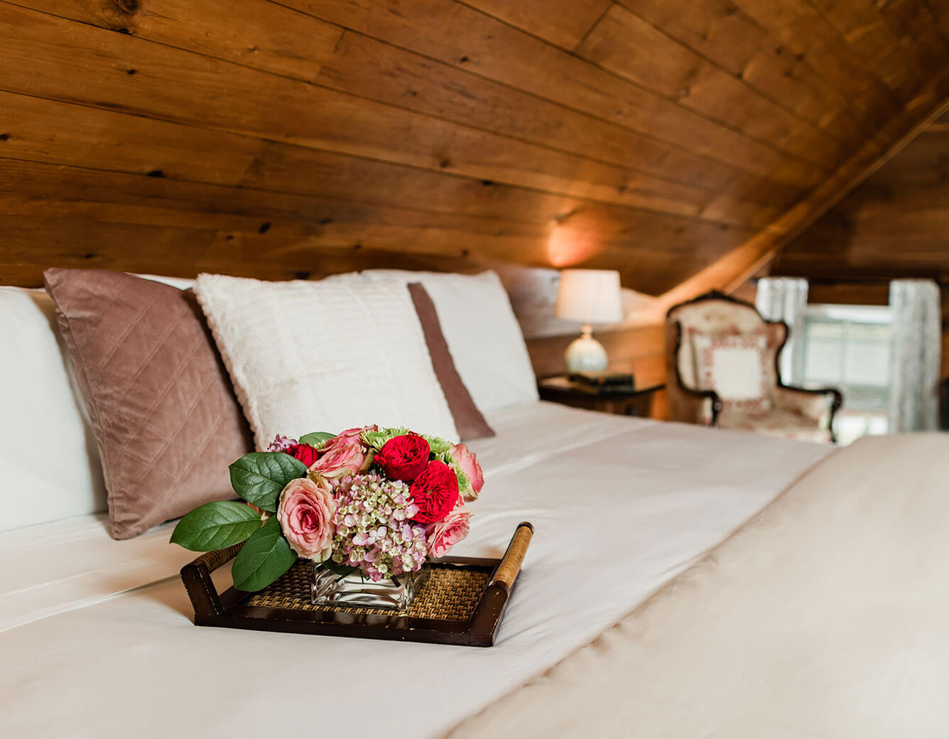 Tray of flowers on bed in the Cherry Room