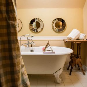 Luxury bathtub with book tray in the Cousin Sarah room