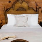 Bed with book on it in the Elizabeth Gray Vining room