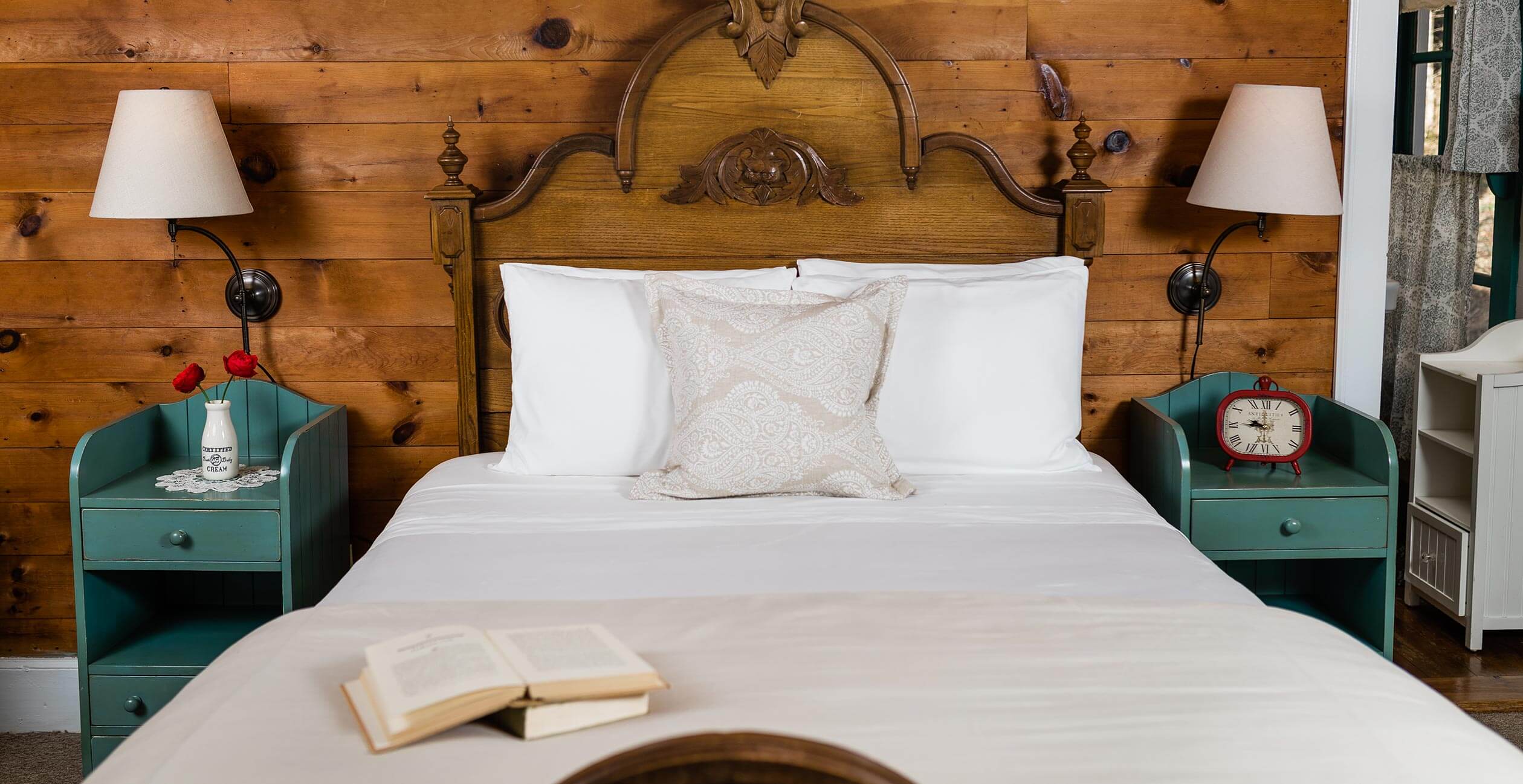 Bed with book on it in the Elizabeth Gray Vining room