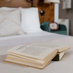 Book sitting on comfortable bed