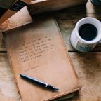 Closed journal by coffee cup in the Elizabeth Gray Vining room