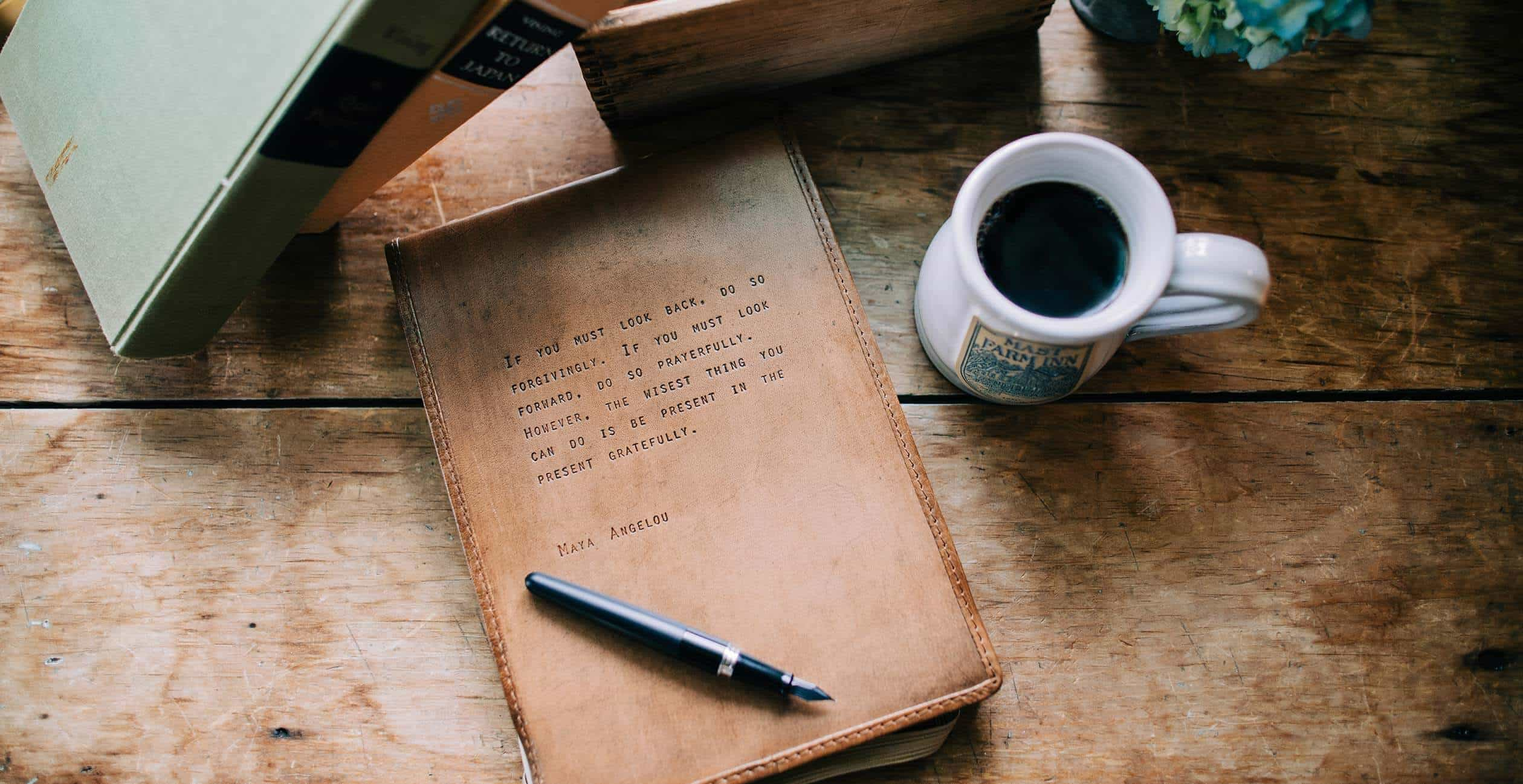 Closed journal by coffee cup in the Elizabeth Gray Vining room