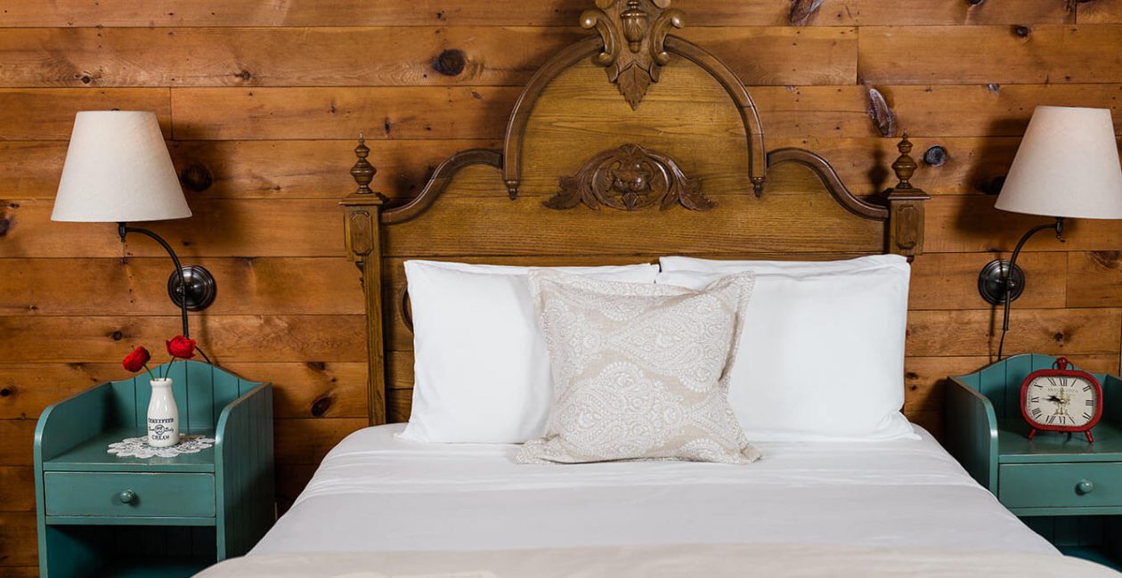 Bed with book on it in the Elizabeth Gray Vining room