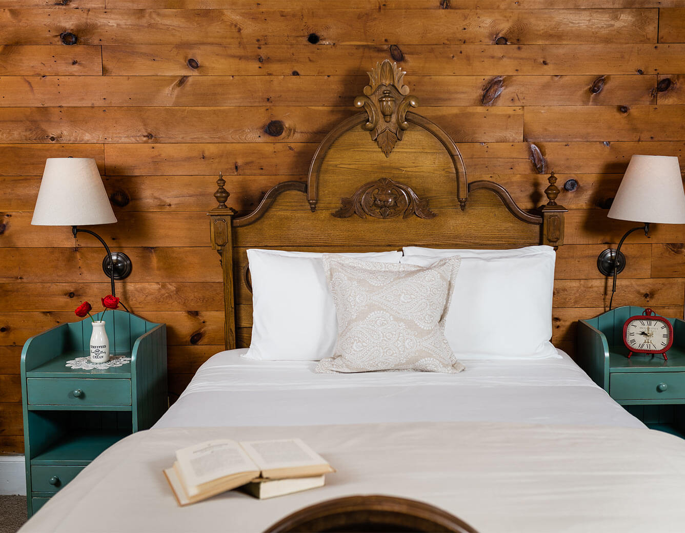 Bed with book on it in the Elizabeth Gray Vining room