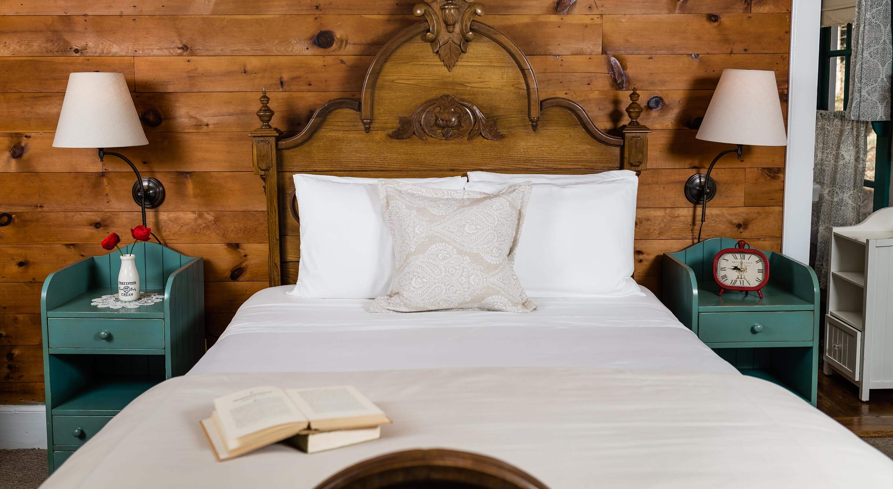 Bed with book on it in the Elizabeth Gray Vining room