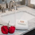 Soap, towel, and roses in the bathroom of the Raspberry Hill cabin