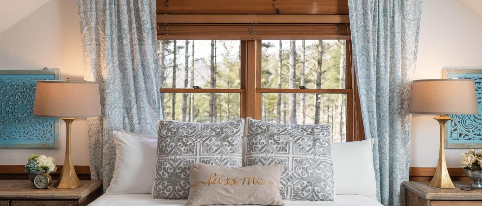 Large bed in front of window