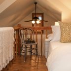 Loft bed under arched roof in North Carolina bed and breakfast