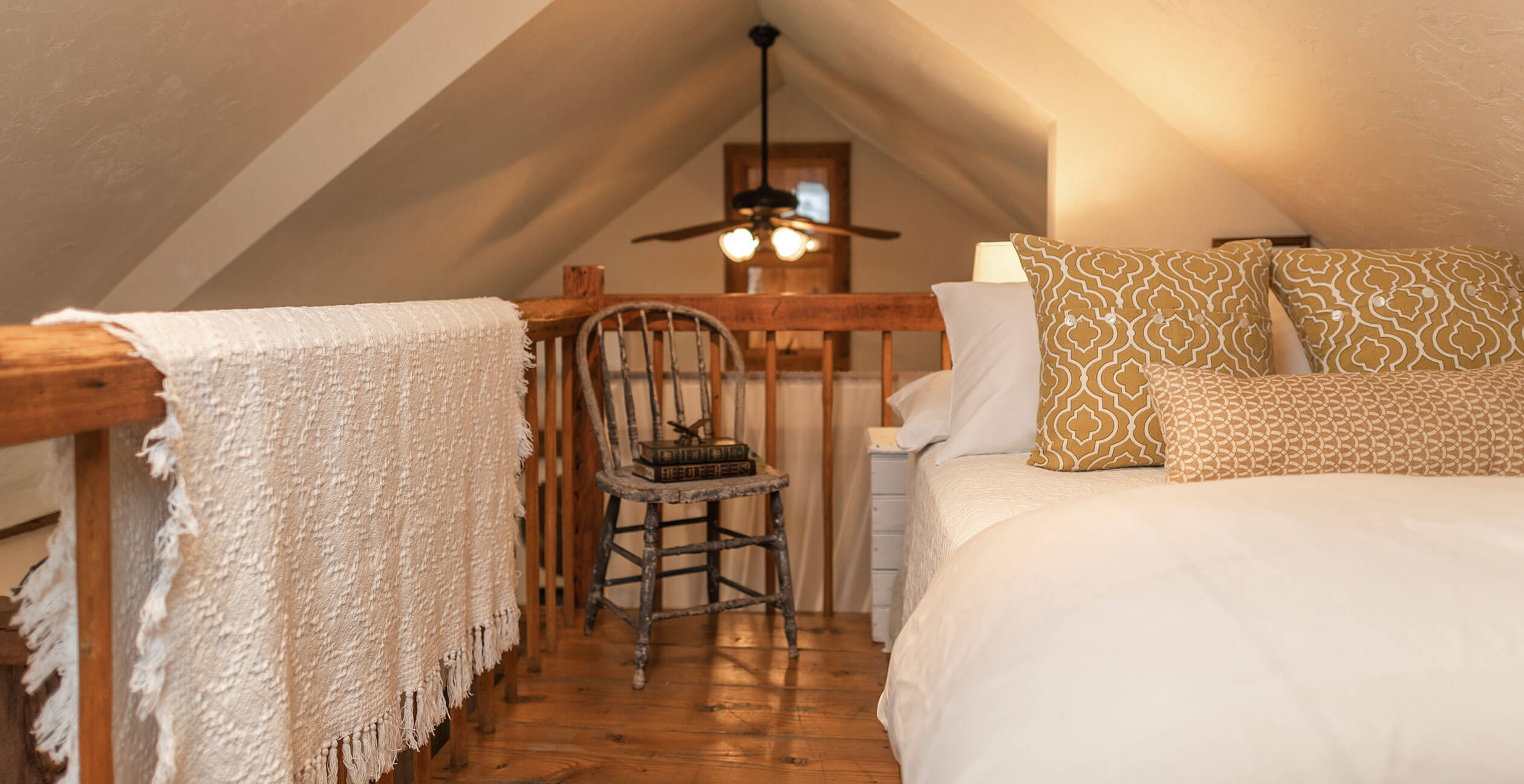 Loft bed under arched roof in North Carolina bed and breakfast