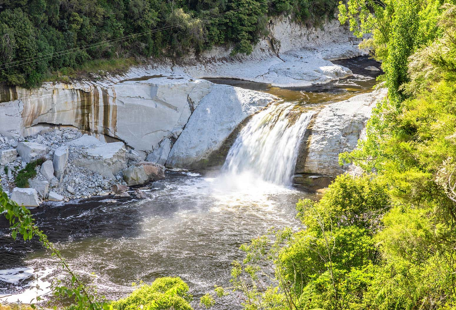 Waterfall pouring into pond