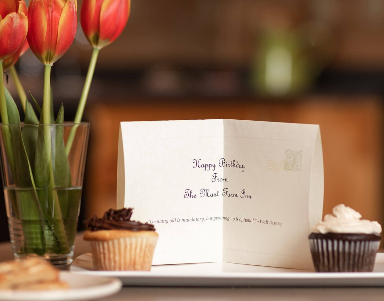 Birthday card, cupcakes and flowers