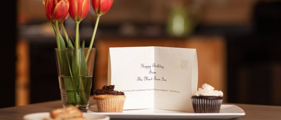 Birthday card, cupcakes and flowers