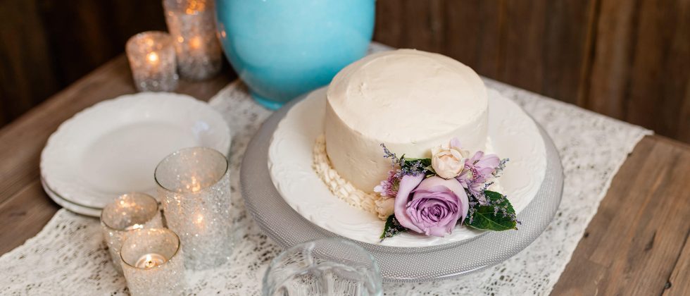 White cake on a plate with forks