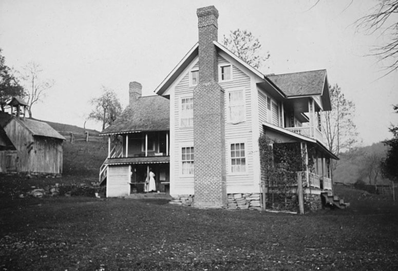 Old black and white photo of The Mast Farm Inn