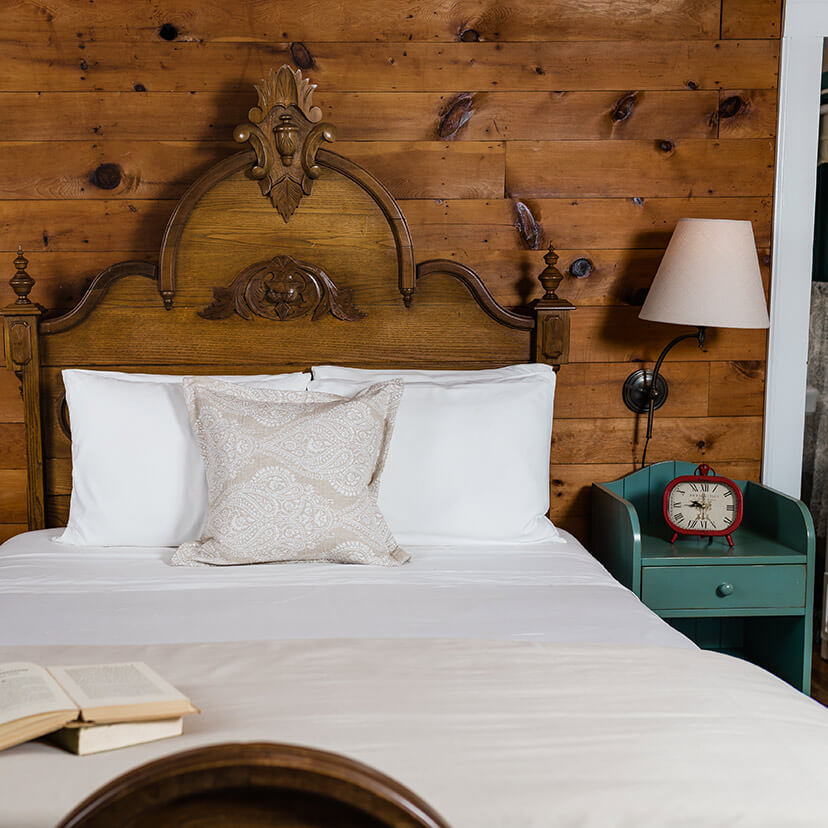 Bed with book on it in the Elizabeth Gray Vining room