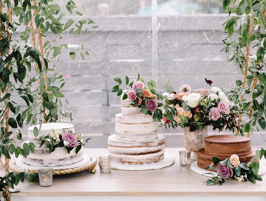 Wedding cakes and flowers at a reception