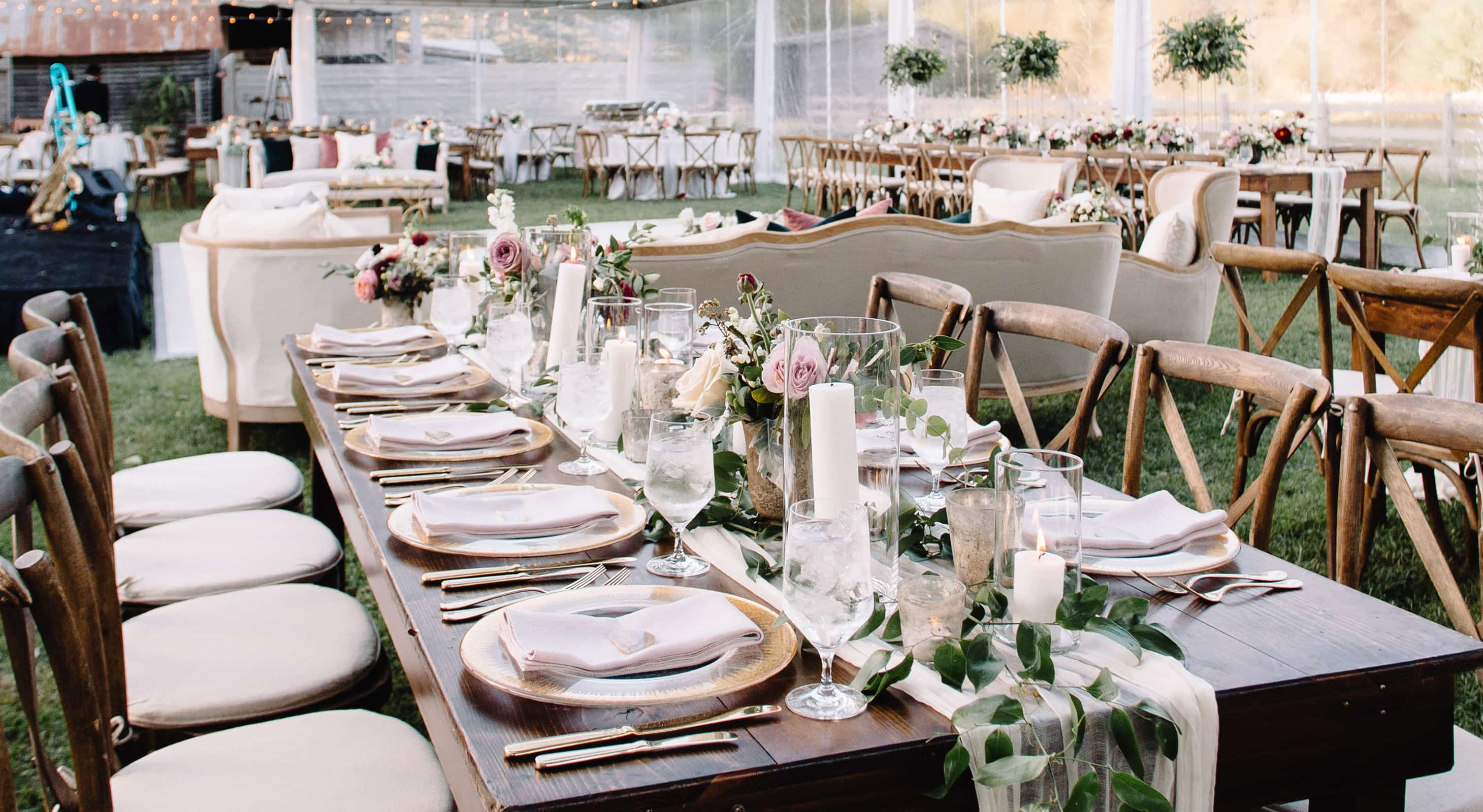 Table set up with elegant decorations and plates for a wedding