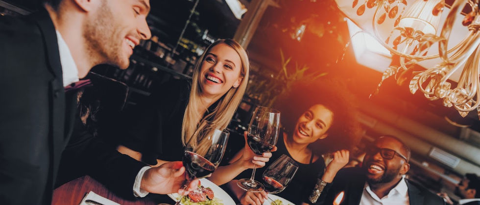 group of friends eating and drinking