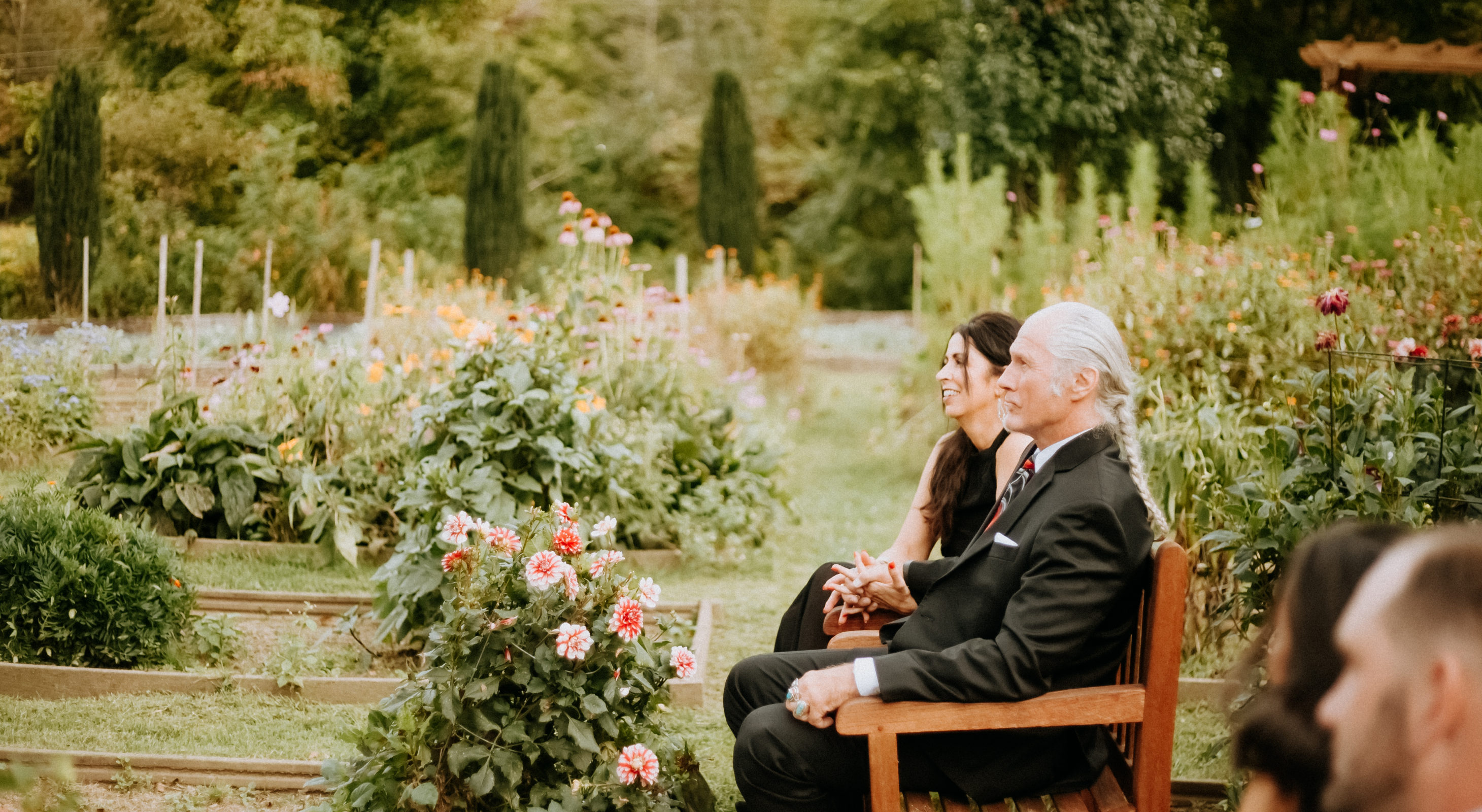 Couple in a open field with a bench